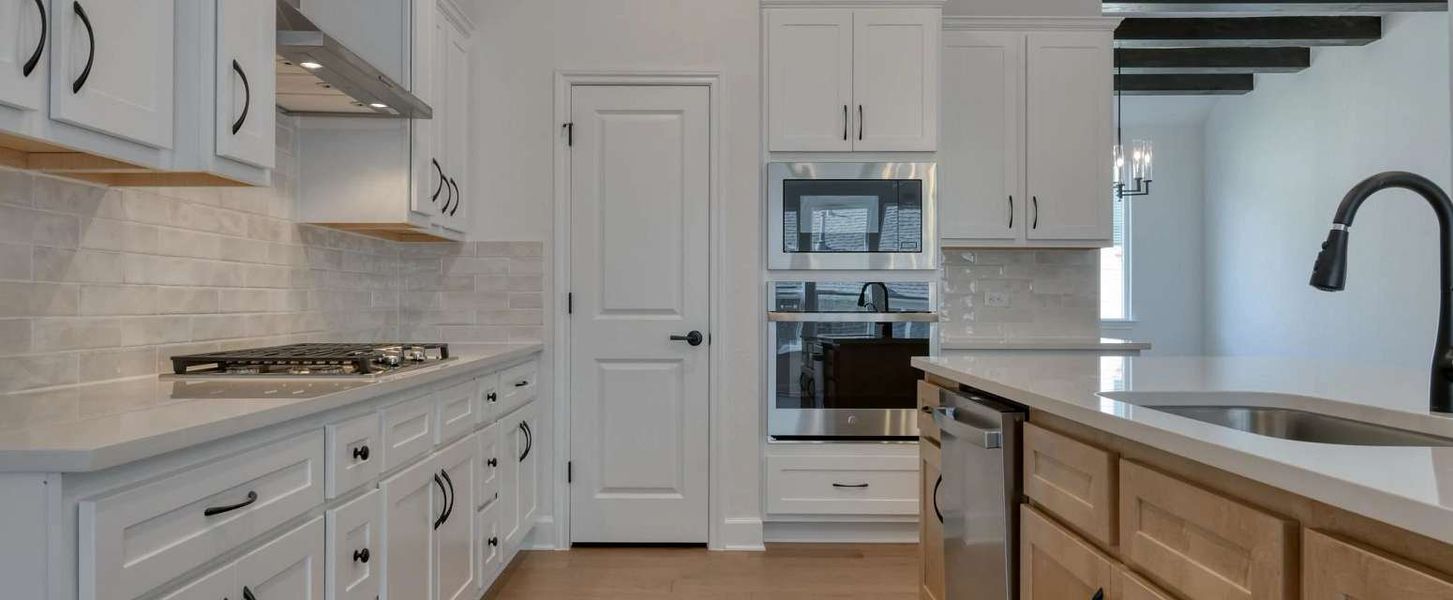 Representative furnished interior of a home built from the Alexander II by Ashton Woods in Sunday Creek at Kinder Ranch, San Antonio (Image 12).
