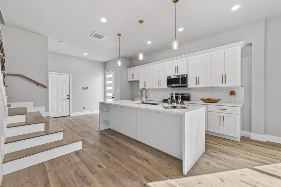 Open-concept layout with seamless flow and elevated lighting design.