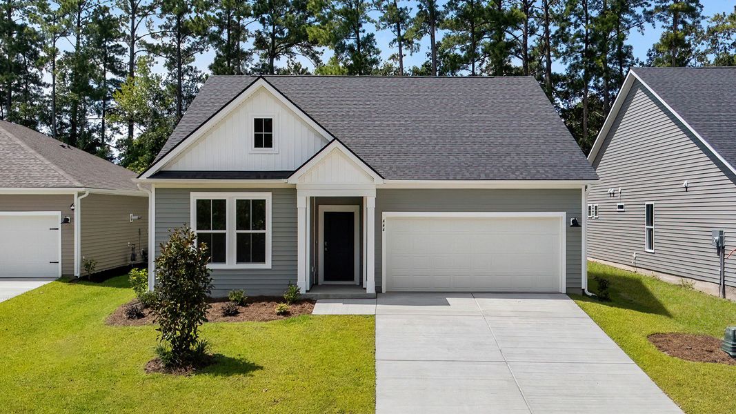 Front exterior of a new home in Bluffs at Sun Colony, Longs, SC, highlighting curb appeal (Image 1).
