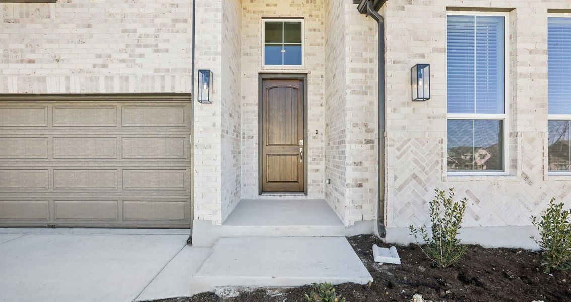 Exterior details and patio area of a home in Sunfield, Buda (Image 3).