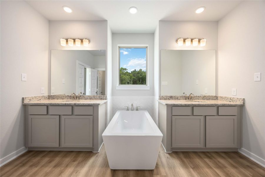 Spa-like primary bath with stunning freestanding tub and abundant natural light—your personal retreat. Spa-like primary bath with stunning freestanding tub and abundant natural light—your personal retreat.