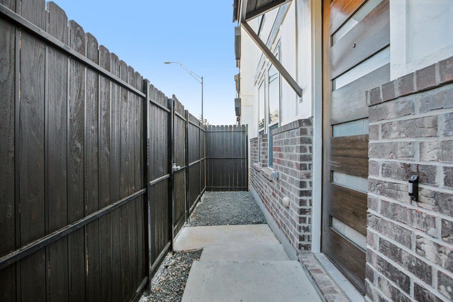 Exterior details and patio area of a home in Koenig Townhomes, Austin (Image 22).
