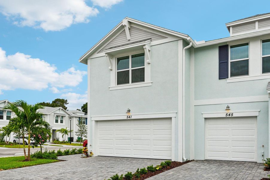 Front exterior of a new home in Tidewater, Fort Pierce, FL, highlighting curb appeal (Image 17). Front exterior of a new home in Tidewater, Fort Pierce, FL, highlighting curb appeal (Image 17).