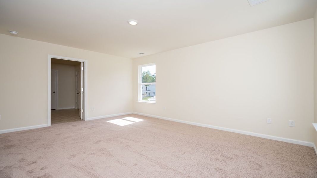 Spacious, unfurnished interior of a new home in The Pines at Blake Farm, Wilmington (Image 32).