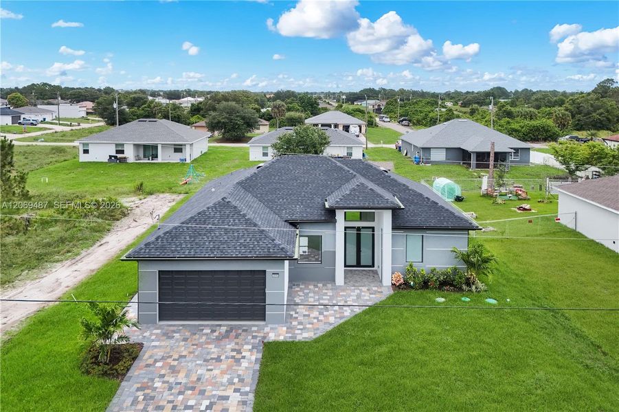 Front exterior of a new home in , Lehigh Acres, FL, highlighting curb appeal (Image 19).