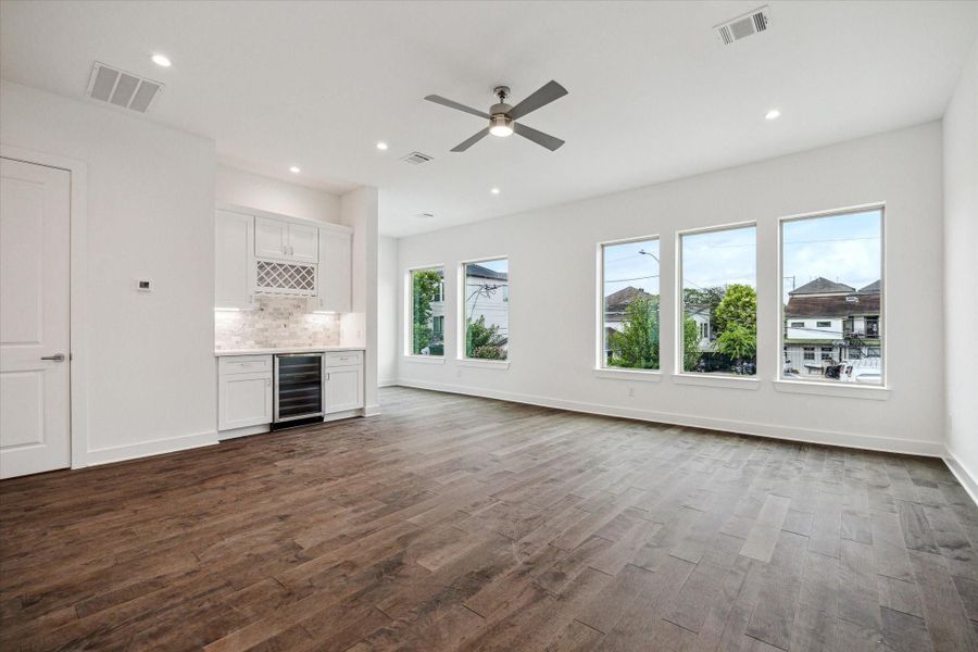 Living Area Has Wall of Windows * 10 Foot High Ceilings.