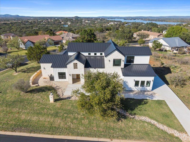 Front exterior of a new home in , Horseshoe Bay, TX, highlighting curb appeal (Image 1). Front exterior of a new home in , Horseshoe Bay, TX, highlighting curb appeal (Image 1).