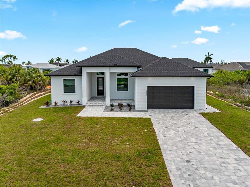 Front exterior of a new home in , Port Charlotte, FL, highlighting curb appeal (Image 29). Front exterior of a new home in , Port Charlotte, FL, highlighting curb appeal (Image 29).