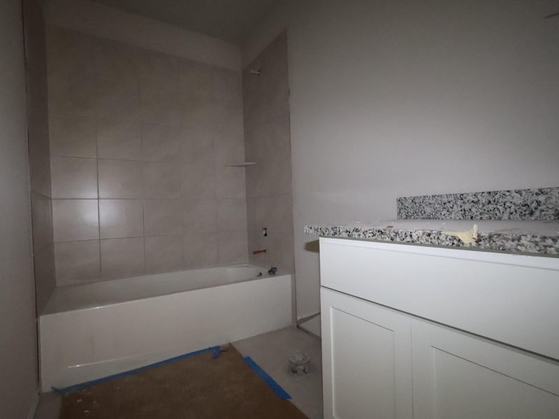 In-progress construction of a new home in Carillon, Manor, TX (Image 23).