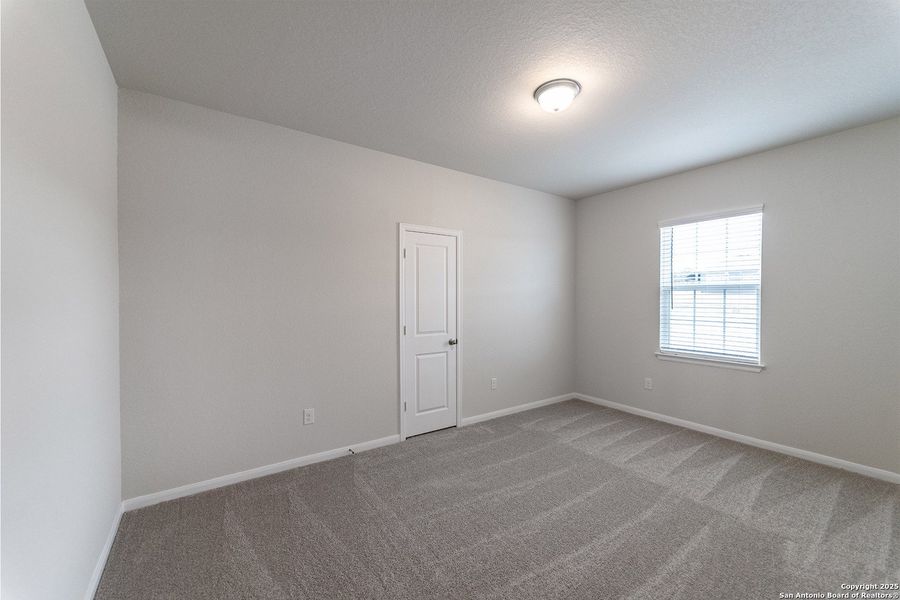 Spacious, unfurnished interior of a new home in The Woodlands at Medina Hills, Mico (Image 15).