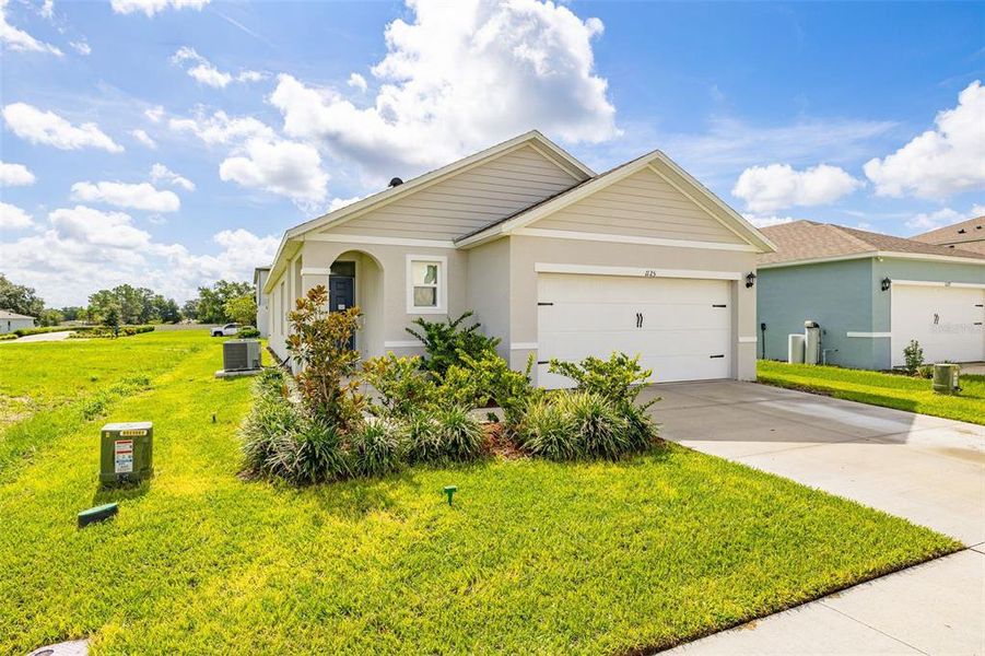 Front exterior of a new home in Bradbury Creek, Haines City, FL, highlighting curb appeal (Image 2). Front exterior of a new home in Bradbury Creek, Haines City, FL, highlighting curb appeal (Image 2).