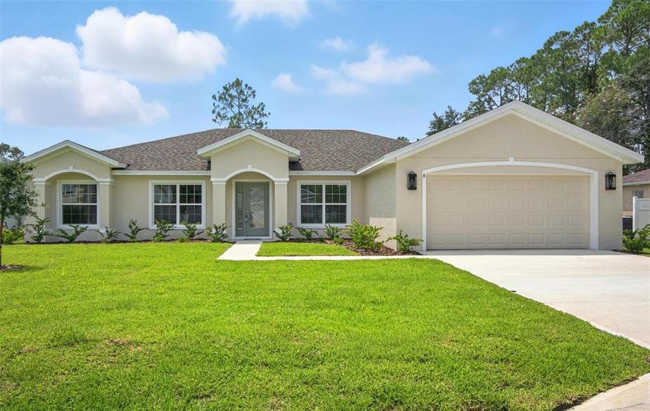 Front exterior of a new home in , Palm Coast, FL, highlighting curb appeal (Image 21).