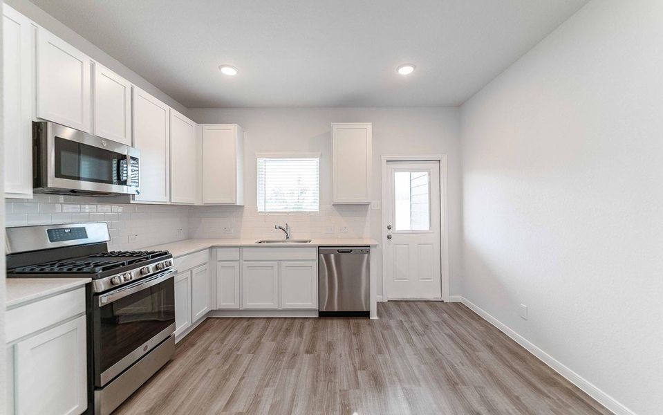 Furnished interior view inside a new home in The Pines at Seven Coves, Willis (Image 3).