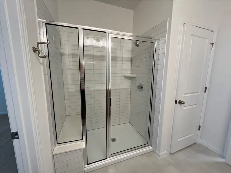 Master bath shower includes quartz bench
