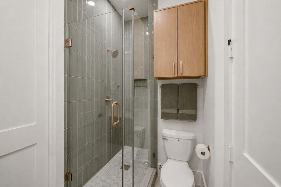 First floor bathroom for guest suite or study.