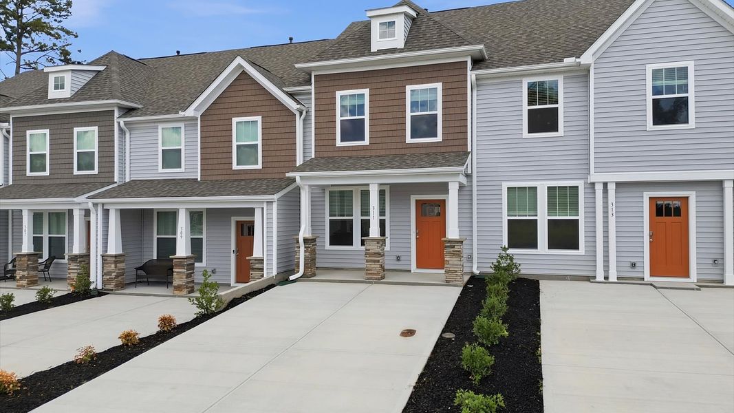 Front exterior of a new home in Clarke Townes, Anderson, SC, highlighting curb appeal (Image 21). Front exterior of a new home in Clarke Townes, Anderson, SC, highlighting curb appeal (Image 21).