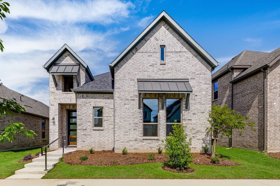 Front exterior of a new home in The Ranch at Uptown Celina, Celina, TX, highlighting curb appeal (Image 1). Front exterior of a new home in The Ranch at Uptown Celina, Celina, TX, highlighting curb appeal (Image 1).