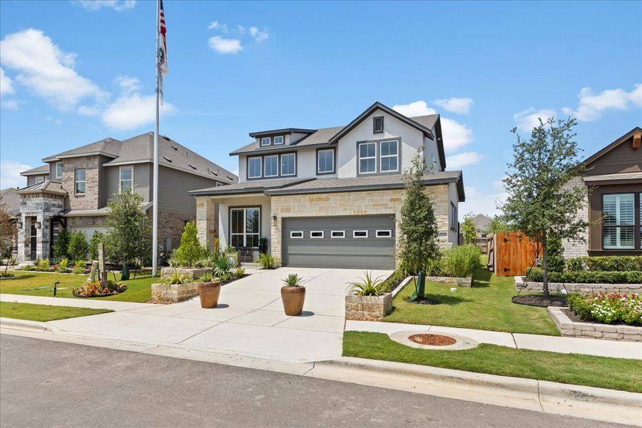 Front exterior of a new home in Meyer Ranch, New Braunfels, TX, highlighting curb appeal (Image 22).