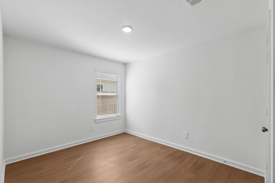 Spacious, unfurnished interior of a new home in Pinewood at Grand Texas, New Caney (Image 9).