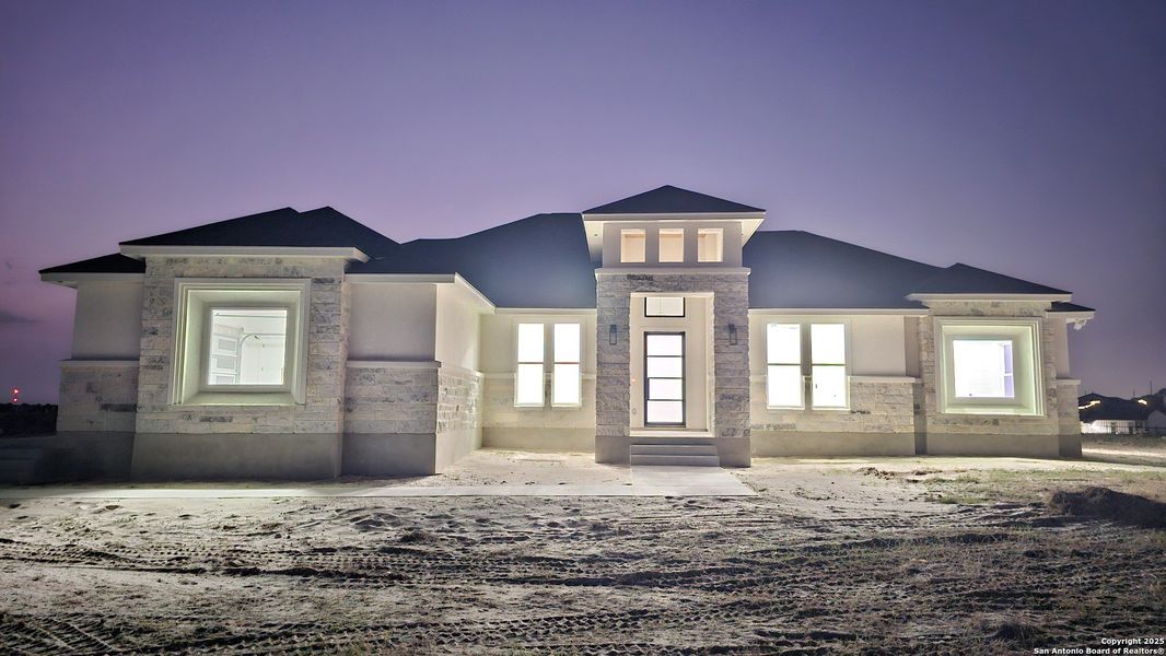 Front exterior of a new home in , La Vernia, TX, highlighting curb appeal (Image 21).