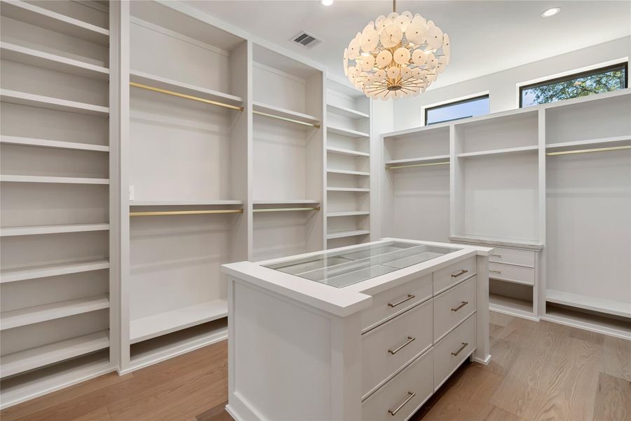A shopper’s paradise! Offering the ultimate in organization and display. NOTE: This photo is a rendering of one of the builder’s prior homes and similarly used as an example for this home. Please contact the listing agent to tour this property and for more detailed information.