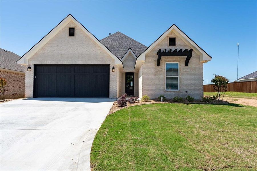 Front exterior of a new home in , Paris, TX, highlighting curb appeal (Image 1). Front exterior of a new home in , Paris, TX, highlighting curb appeal (Image 1).