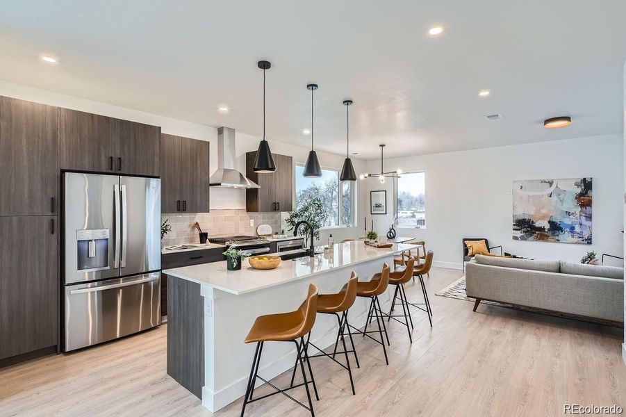 Open floorplan great for relaxing or entertaining - Island with seating, gas cooktop, stainless appliances, quartz countertops