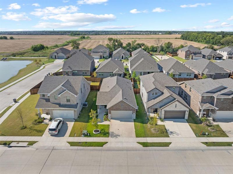 Aerial perspective of suburban area featuring a nearby body of water Aerial perspective of suburban area featuring a nearby body of water