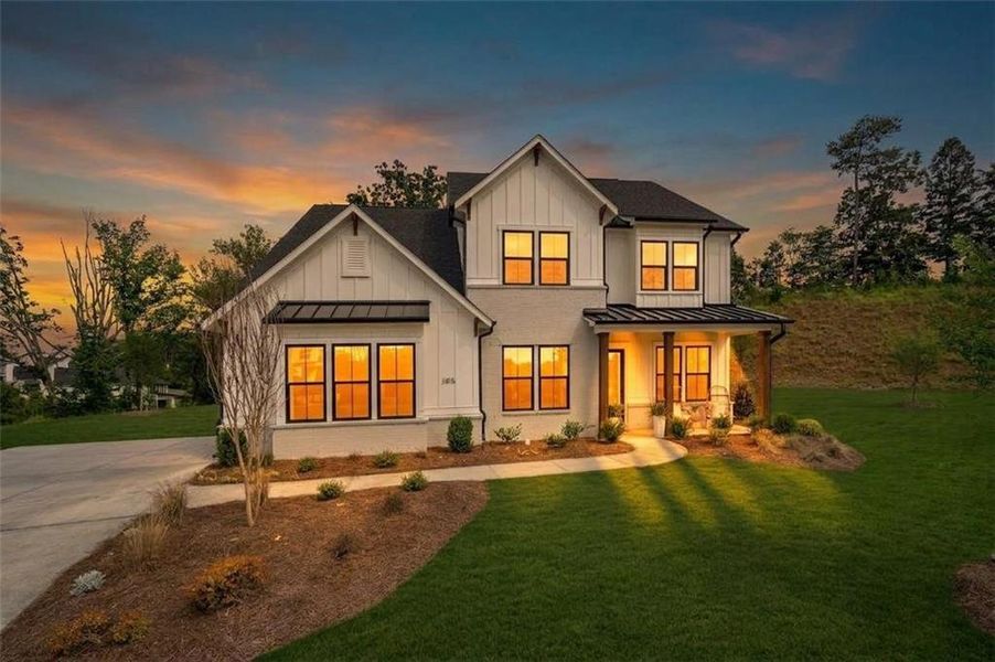 Front exterior of a new home in Sterling Pointe, Cumming, GA, highlighting curb appeal (Image 1). Front exterior of a new home in Sterling Pointe, Cumming, GA, highlighting curb appeal (Image 1).