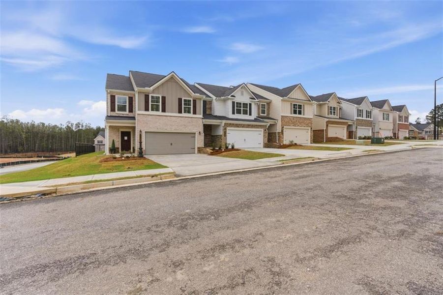 Front exterior of a new home in Park Center Pointe, Mableton, GA, highlighting curb appeal (Image 25).