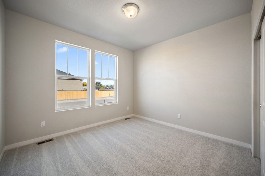 Spacious, unfurnished interior of a new home in The Glen, Colorado Springs (Image 14).