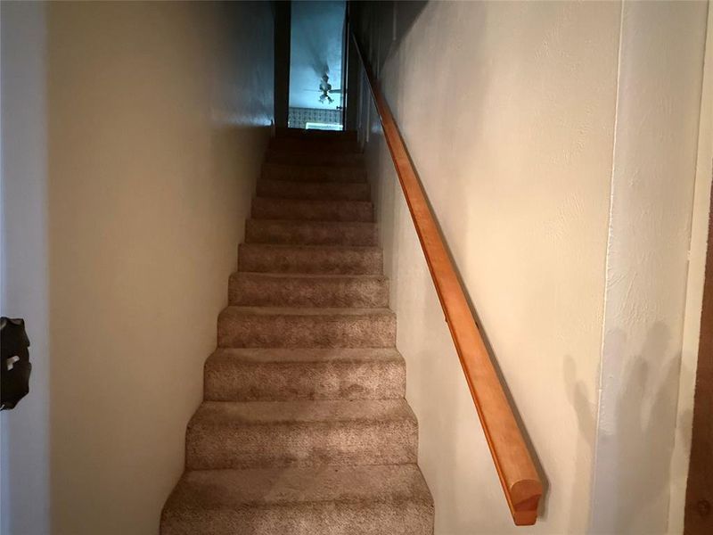 Stairway to two bedrooms and bathroom. Stairway to two bedrooms and bathroom.