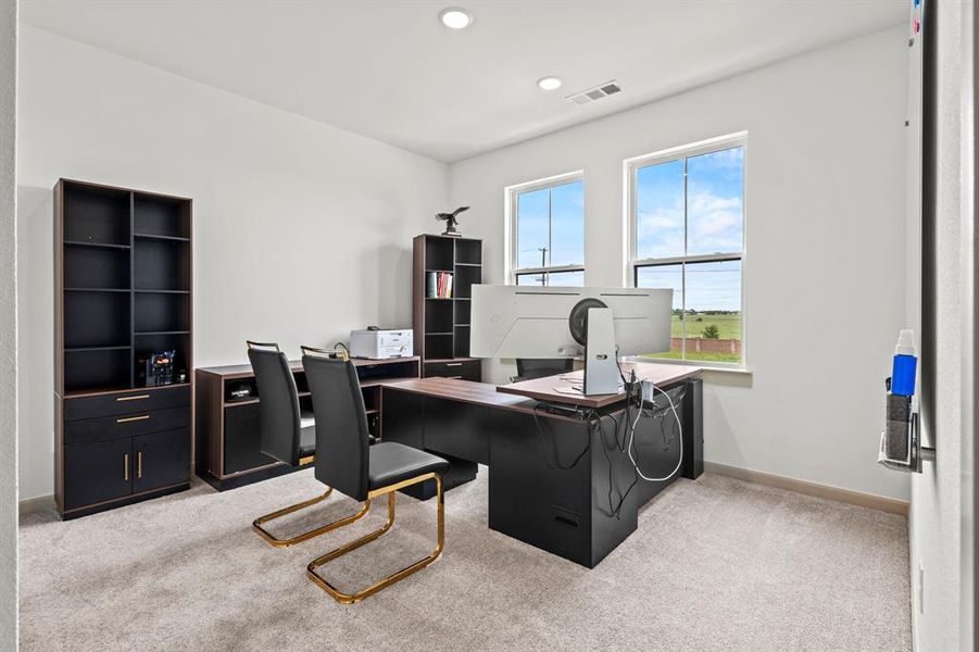 Carpeted home office with baseboards and recessed lighting