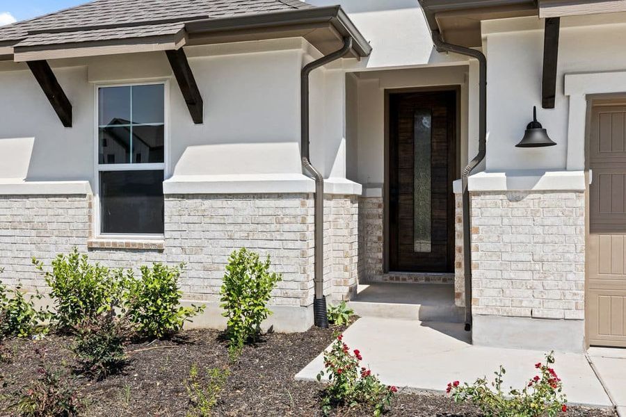 Exterior details and patio area of a home in Lariat, Liberty Hill (Image 4). Exterior details and patio area of a home in Lariat, Liberty Hill (Image 4).
