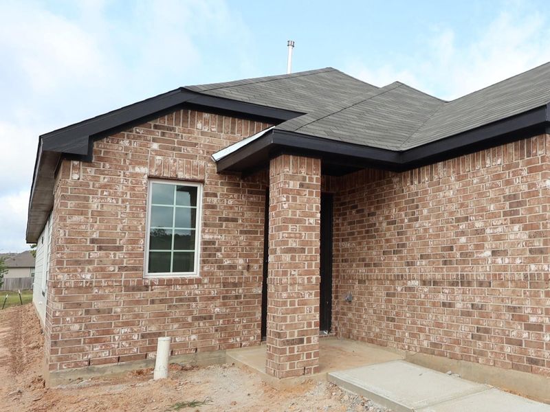 Front exterior of a new home in Magnolia Ridge, Magnolia, TX, highlighting curb appeal (Image 1). Front exterior of a new home in Magnolia Ridge, Magnolia, TX, highlighting curb appeal (Image 1).