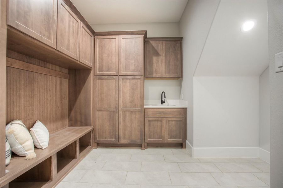 The mud room is just off the garage. Super handly for unloading on your way in.