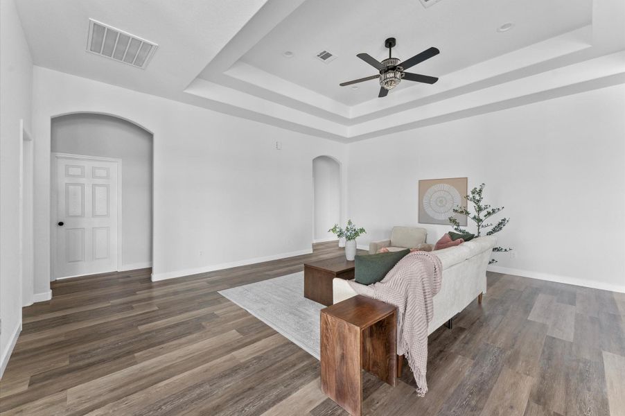 Spacious living room with soaring ceilings, abundant natural light, and seamless flow to the dining and kitchen. Spacious living room with soaring ceilings, abundant natural light, and seamless flow to the dining and kitchen.