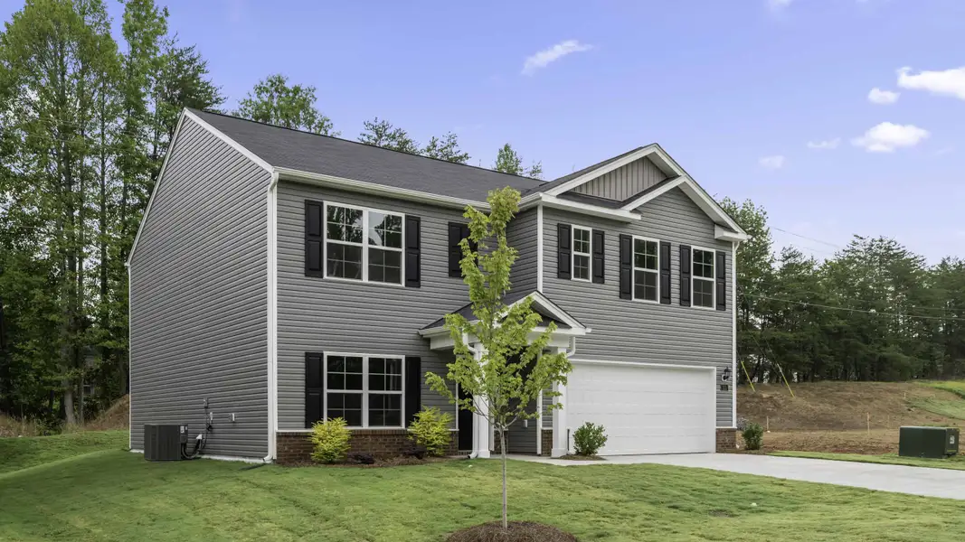 Front exterior of a new home in Baymeade, Lexington, NC, highlighting curb appeal (Image 2). Front exterior of a new home in Baymeade, Lexington, NC, highlighting curb appeal (Image 2).