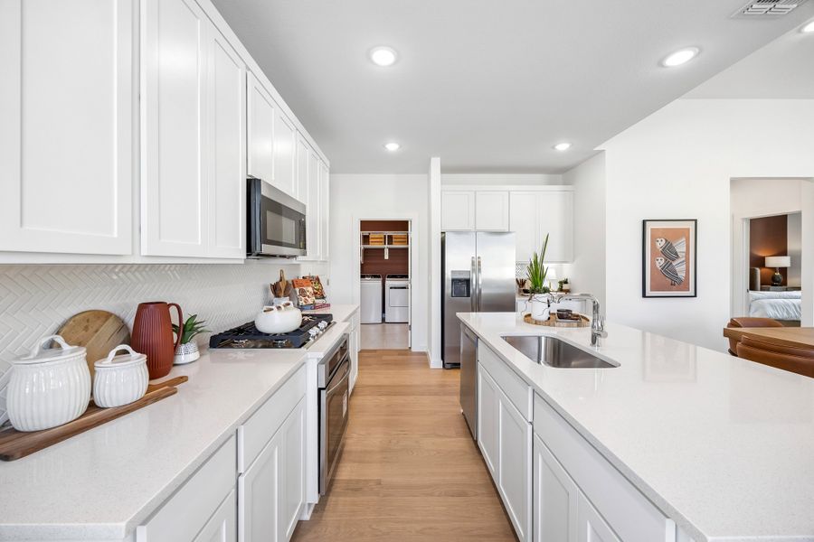 Kitchen in the Magnolia home plan by Trophy Signature Homes – REPRESENTATIVE PHOTO Kitchen in the Magnolia home plan by Trophy Signature Homes – REPRESENTATIVE PHOTO