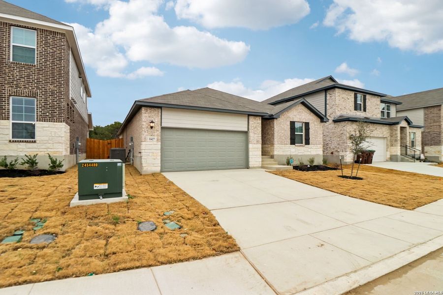 Front exterior of a new home in Sagebrooke - Classic Series, San Antonio, TX, highlighting curb appeal (Image 23).