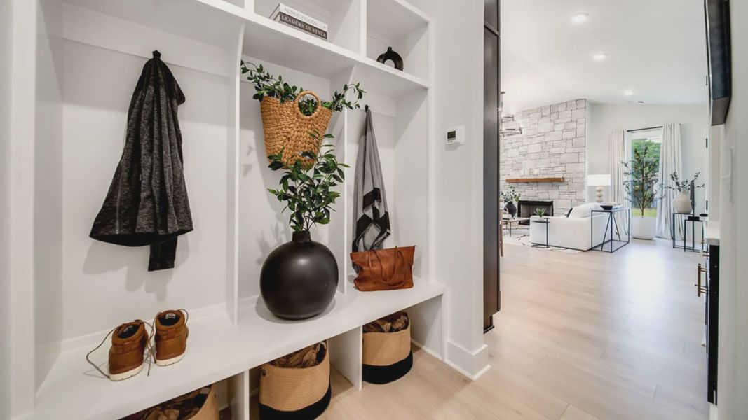 Convenient mudroom storage option next to living area.