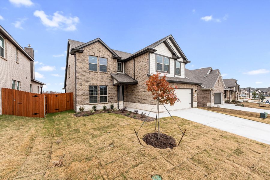 Front exterior of a new home in Northstar, Haslet, TX, highlighting curb appeal (Image 24). Front exterior of a new home in Northstar, Haslet, TX, highlighting curb appeal (Image 24).