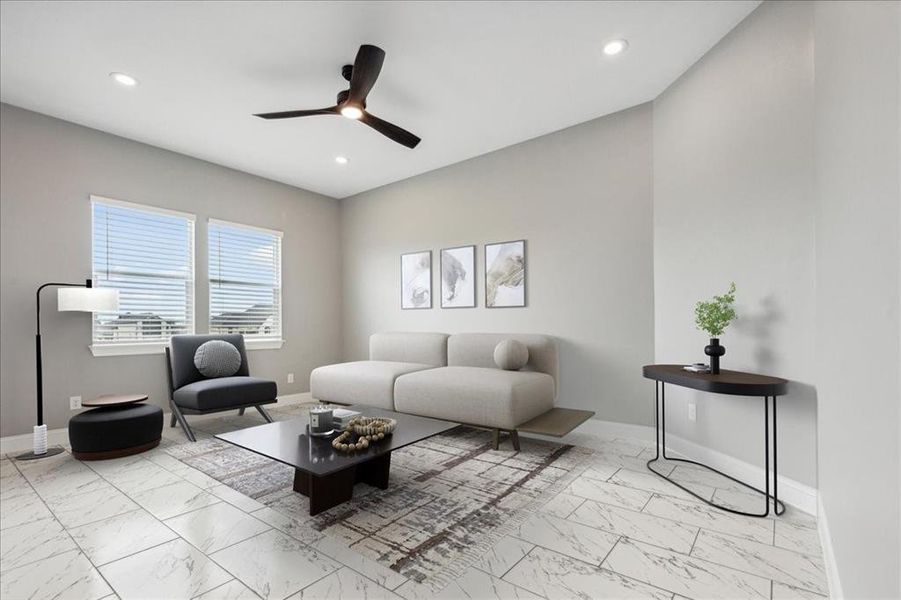 Living room featuring ceiling fan and light tile floors