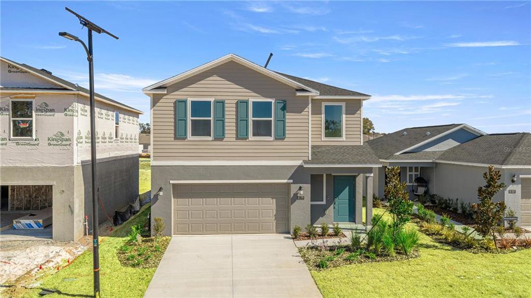 Front exterior of a new home in Millwood, Ocala, FL, highlighting curb appeal (Image 1). Front exterior of a new home in Millwood, Ocala, FL, highlighting curb appeal (Image 1).
