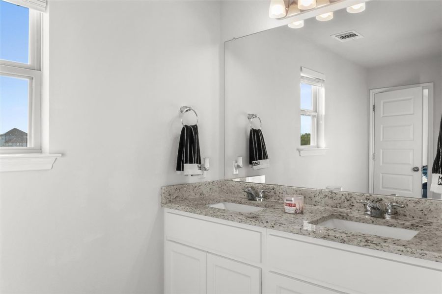 Full bathroom featuring double vanity