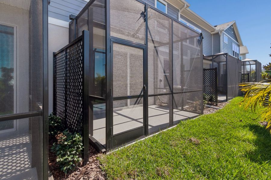 Exterior details and patio area of a home in North River Ranch – Townhomes, Parrish (Image 4).
