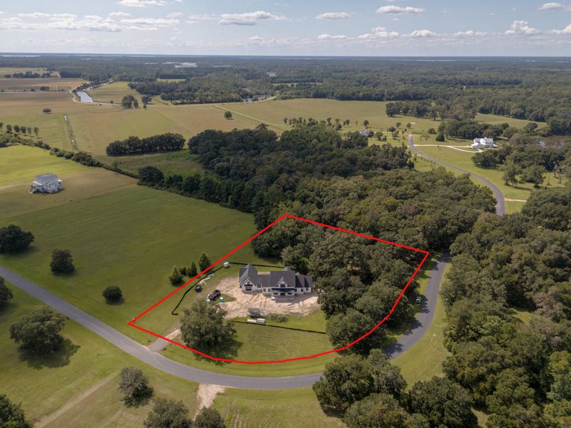 Front exterior of a new home in , Wadmalaw Island, SC, highlighting curb appeal (Image 7). Front exterior of a new home in , Wadmalaw Island, SC, highlighting curb appeal (Image 7).