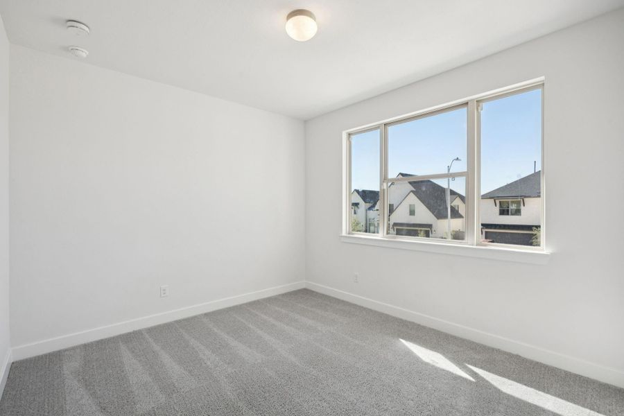 This comfortable third bedroom offers a bright and inviting space, featuring beautiful large windows. This comfortable third bedroom offers a bright and inviting space, featuring beautiful large windows.