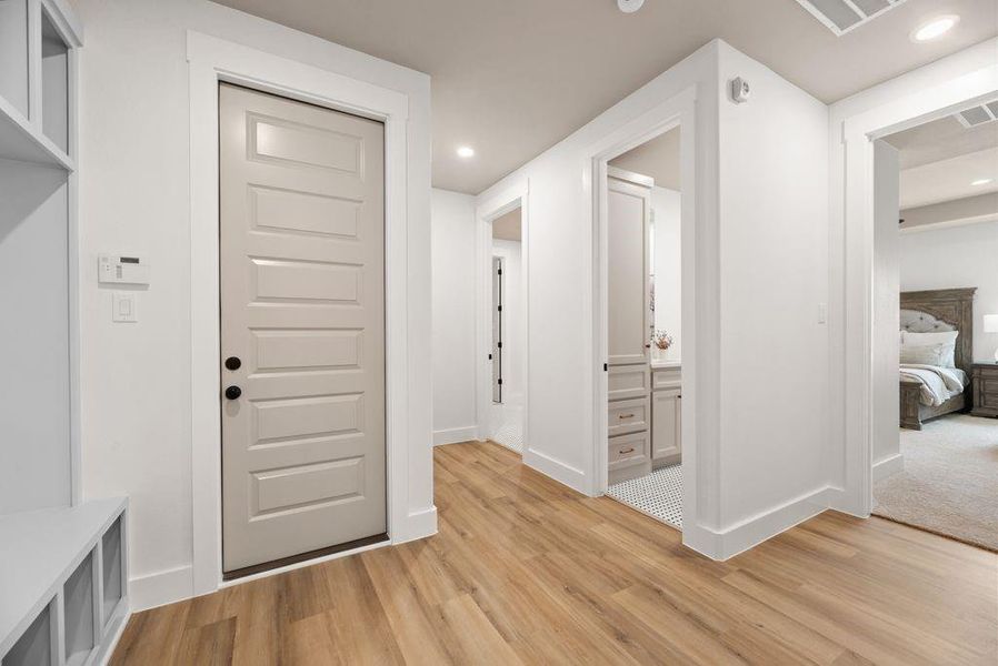 Mudroom featuring light wood-type flooring and recessed lighting Mudroom featuring light wood-type flooring and recessed lighting