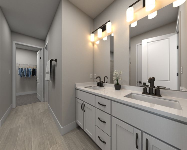 The primary bathroom offers dual vanity sinks and a walk-in closet. The primary bathroom offers dual vanity sinks and a walk-in closet.